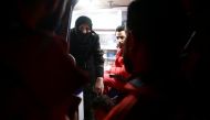 A woman and girl are seen in an ambulance during medical evacuation from the besieged town of Douma, eastern Ghouta to Damascus, Syria December 27, 2017. REUTERS/Bassam Khabieh.