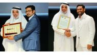 Salah Al Mulla presenting the awards to Firose S A (left) and Saleel Ibrahim.