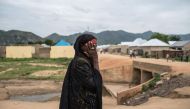 A woman covers her face in north-eastern Nigeria, an area devastated by eight years of Boko Haram’s Islamist insurgency. Photograph: Stefan Heunis/AFP.