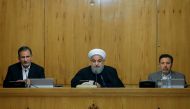 President of Iran Hassan Rouhani (C) addresses during the cabinet meeting in Tehran, Iran on December 31, 2017. First Vice President of Iran Eshaq Jahangiri (L) also attended the meeting. ( Iranian Presidency / Anadolu Agency )