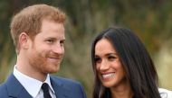 Britain's Prince Harry poses with Meghan Markle in the Sunken Garden of Kensington Palace in London, Britain, November 27, 2017. Reuters/Toby Melville