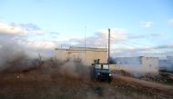 Opposition fighters drive in the village of Fureiji near al-Tamanah, in Syria's northwestern rebel-held province of Idlib, as they continue to battle government forces on January 2, 2018. / AFP / OMAR HAJ KADOUR
