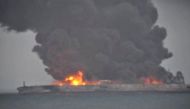 Smoke and fire is seen from Panama-registered tanker SANCHI carrying Iranian oil after it collided with a Chinese freight ship in the East China Sea, in this still image taken from a January 7, 2018 video. China Central Television (CCTV) via REUTERS TV