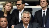 This file photo taken on April 23, 2014 shows France's former Prime Minister Dominique de Villepin (C) and businessman Alexandre Djouhri (L) attending the French L1 football match between Paris Saint-Germain (PSG) and Evian-Thonon (ETG) at the Parc des Pr