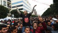 Tunisians shout slogans during a demonstration against the government and price hikes on January 9, 2018 in Tunis. AFP / Fethi Belaid