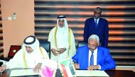Qatar’s Attorney-General H E Dr Ali bin Fetais Al Marri and Sudan’s Attorney General Maulana Omar Ahmed Mohammed signing the MoU.