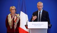 French Finance Minister Bruno Le Maire (R) speaks during a news conference about Lactalis baby milk contamination scandal next to Virginie Beaumeunier, head of the Competition Policy, Consumer Affairs and Fraud Control Agency (DGCCRF), at the Bercy Financ