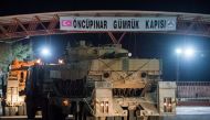 Turkish military vehicles cross into Syria at Oncupinar border gate in Kilis, Turkey, January 20, 2018. Picture taken January 20, 2018. Can Erok/Dogan News Agency
