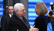 Palestinian President Mahmud Abbas (L) is welcomed by EU foreign policy chief Federica Mogherini prior to attend a EU foreign affairs council at the European Council in Brussels, January 22, 2018. AFP / Emmanuel Dunand