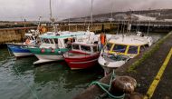 Fishing boats block the access to the harbour of Boulogne-sur-Mer on January 25, 2018 as they protest against electric pulse fishing practiced by fishermen from Netherlands. AFP / Philippe Huguen