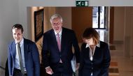 EU Chief negotiator for Brexit, Michel Barnier (C) walks with deputy Secretary of Communication of the People's Party (PP), Pablo Casado (L), and Spokeswoman of the Socialist Group in the Congress of Deputie, Soraya Rodriguez (R), during a European Union 