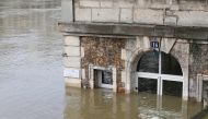 This photo was taken on January 28, 2018, shows the cafe 'Les Nautes' in Paris partly immersed in the the water of the Seine river.   AFP / GEOFFROY VAN DER HASSELT
