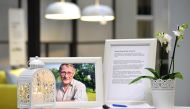 A photo of Ingvar Kamprad, founder of Swedish multinational furniture retailer IKEA, and a book of condolences are placed at the entrance of an IKEA store in Stockholm, Sweden, January 28, 2018. TT News Agency/Anders Wiklund/via Reuters