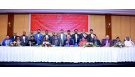 A group photo of guests with alumni team.