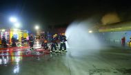 The members of fire fighting team in action. 
