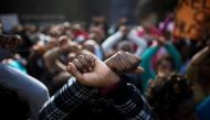 File photo of an African migrant gesturing during a protest, held by women and children of the migrant community, against Israel's detention policy toward migrants, in Tel Aviv, Israel January 15, 2014. REUTERS/Ronen Zvulun/File Photo