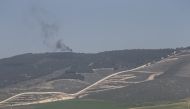 A photo taken from Turkey's Hatay province, on January 30, 2018 shows smoke rising as the PYD/PKK terror group targets on the opposite side of Reyhanli and Hassa districts being hit within the 'Operation Olive Branch' launched in Syria's Afrin.  Cem Genco