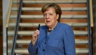 German Chancellor Angela merkel gives a statement as she arrives at the Social Democrats Party (SPD) headquarters on February 4, 2018 in Berlin. / AFP / Tobias SCHWARZ

