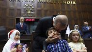 Children read poem near President of Turkey and Leader of the Justice and Development Party (AK Party) Recep Tayyip Erdogan, after AK Party parliamentary group meeting at the Grand National Assembly of Turkey (TBMM) in Ankara, Turkey on February 06, 2018.