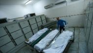Bodies of Pakistani migrants who died when a boat sank off Libya's western coast, are seen in Tripoli Central Hospital in Tripoli, Libya, February 7, 2018. REUTERS/Ismail Zitouny