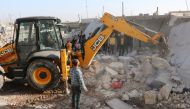 Members of Syrian NGOs conduct search and rescue operation amid debris after Assad Regime carried out an airstrike over Has village located at Syria's Idlib, which is a de-escalation zone, on February 09, 2018. Following the attack, 15 civilian lost their