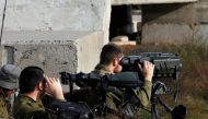 A picture taken on February 10, 2018 show Israeli solders taking positions in the occupied Golan Heights near the border with Syria.   AFP / JALAA MAREY
