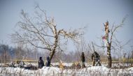 Russian Emergency Ministry rescuers work at the site of a plane crash in Ramensky district, on the outskirts of Moscow on February 12, 2018. AFP / Vasily MAXIMOV 