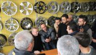 President of Turkey Recep Tayyip Erdogan (2nd L) visits a tyre shop on the route to the Presidential Complex in Ankara, Turkey on February 12, 2018. ( Turkish Presidency / Murat Cetinmuhurdar / Anadolu Agency)