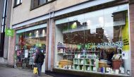 A man walks past the front of an Oxfam bookshop in Glasgow on February 10, 2018. AFP / Andy Buchanan