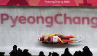 Germany's Tobias Wendl and Tobias Arlt compete in the doubles luge run 1 during the Pyeongchang 2018 Winter Olympic Games at the Olympic Sliding Centre on February 14, 2018 in Pyeongchang. / AFP / Mark RALSTON 