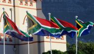 South African flags are seen during a ceremony ahead of South Africa's newly-minted president National address at the Parliament in Cape Town, on February 16, 2018.  AFP / Nasief Manie
