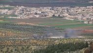 Smoke rises after a tank of Turkish Armed Forces fired to the positions of PYD/PKK  in Afrin town of Syria, on February 19, 2018. Mahmud Faysal - Anadolu 