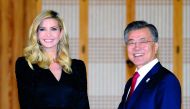 South Korean President Moon Jae-In (R) shakes hands with Ivanka Trump during their dinner meeting at the Presidential Blue House in Seoul on February 23, 2018. AFP  / Kim Min-Hee