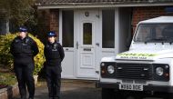 British Police Community Support Officers stand on duty outside a residential property in Salisbury, southern England, on March 6, 2018, believed to have been cordonned off in connection with the major incident which started at The Maltings shopping centr