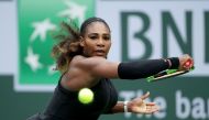  Serena Williams lunges to return a backhand to Kiki Bertens of the Netherlands during the BNP Paribas Open on March 10, 2018 at the Indian Wells Tennis Garden in Indian Wells, California. Jeff Gross/Getty Images/AFP