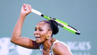 Venus Williams of the United States reacts to her forehand in her match against Serena Williams of the United States during the BNP Paribas Open at the Indian Wells Tennis Garden on March 12, 2018 in Indian Wells, California. Harry How/Getty Images/AFP 