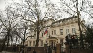 People walk past one of the entrances to Russia's embassy and consular section in London, Britain, March 13, 2018. REUTERS/Tom Jacobs