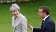 FILE PHOTO: French President Emmanuel Macron (R) escorts Britain's Prime Minister Theresa May after they spoke to the press at the Elysee Palace in Paris, France, June 13, 2017. REUTERS/Philippe Wojazer/File Photo