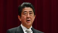 Japan's Prime Minister Shinzo Abe delivers a speech during the graduation ceremony for the National Defense Academy in Yokosuka, Kanagawa prefecture on March 18, 2018. AFP / Kazuhiro NOGI