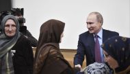 Russian President Vladimir Putin (R, back) attends a meeting with local residents in Makhachkala, Russia March 13, 2018. Sputnik/Alexei Nikolsky/Kremlin via Reuters