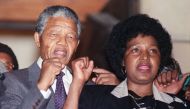 In this file photo taken on February 11, 1990, anti-apartheid leader and African National Congress (ANC) member Nelson Mandela and wife Winnie Madikizela-Mandela raise fists upon Mandela release from Victor Verster prison in Paarl.  AFP / Walter Dhaldhla