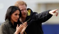 Britain's Prince Harry, Patron of the Invictus Games Foundation, and Meghan Markle watch athletes at the team trials for the Invictus Games Sydney 2018 at the University of Bath Sports Training Village in Bath, Britain, April 6, 2018. Reuters/Peter Nichol