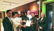 The staff and management team of the InterContinental Doha The City celebrating the success of winning two prestigious FACT Qatar Dining Awards.