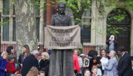 People attending the official unveiling gather around the statue of suffragist Millicent Fawcett on Parliament Square after the ceremony, in London, Britain, April 24, 2018. REUTERS/Hannah McKay