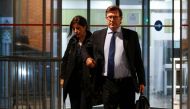 Vincent Bollore's lawyers Olivier Baratelli (R) and Celine Astolfe (L) leave overnight on April 24, 2018, the anti-corruption police office (OCLCIFF) in Nanterre, western suburbs of Paris, after the detention of Billionaire French tycoon Vincent Bollore a