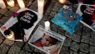 Candles and placards are pictured during a protest in support of Alfie Evans, in front of the British Embassy building in Warsaw, Poland April 26, 2018. REUTERS/Kacper Pempel
 