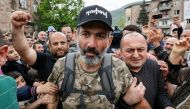 People greet Armenian opposition leader Nikol Pashinyan as he arrives at a rally in the town of Ijevan, Armenia April 28, 2018. Reuters/Gleb Garanich