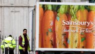 Workers unload a Sainsbury's home delivery van in central London, Britain, April 30, 2018. REUTERS/Toby Melville