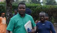 Melchiade Nzopfabarushe (L), member of Burundi's ruling National Council for the Defense of Democracy–Forces for the Defense of Democracy (CNDD-FDD) party and accused of inciting members of the ruling party to assassinate political opponents, is pictured 
