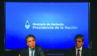 Argentina's Minister of the Treasury Nicolas Dujovne (L) and Argentina's Finance Minister Luis Caputo offer a press conference at the Ministry headquarters in Buenos Aires, on May 04, 2018.  AFP / Eitan Abramovich